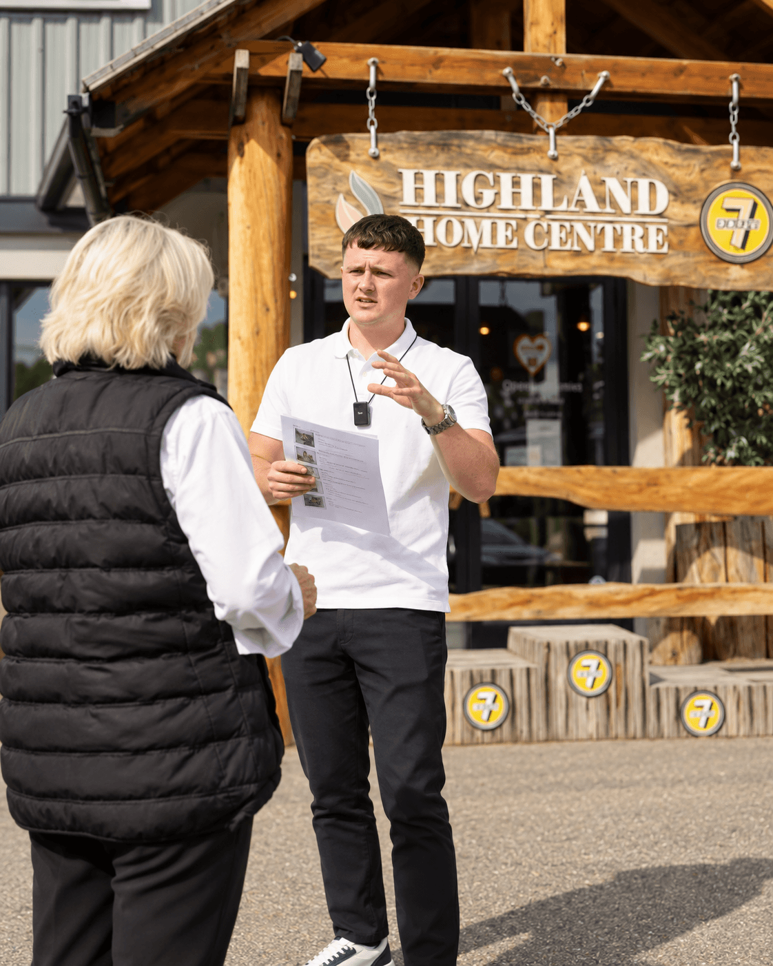 Kieren briefing a client before filming at Highland Home Centre