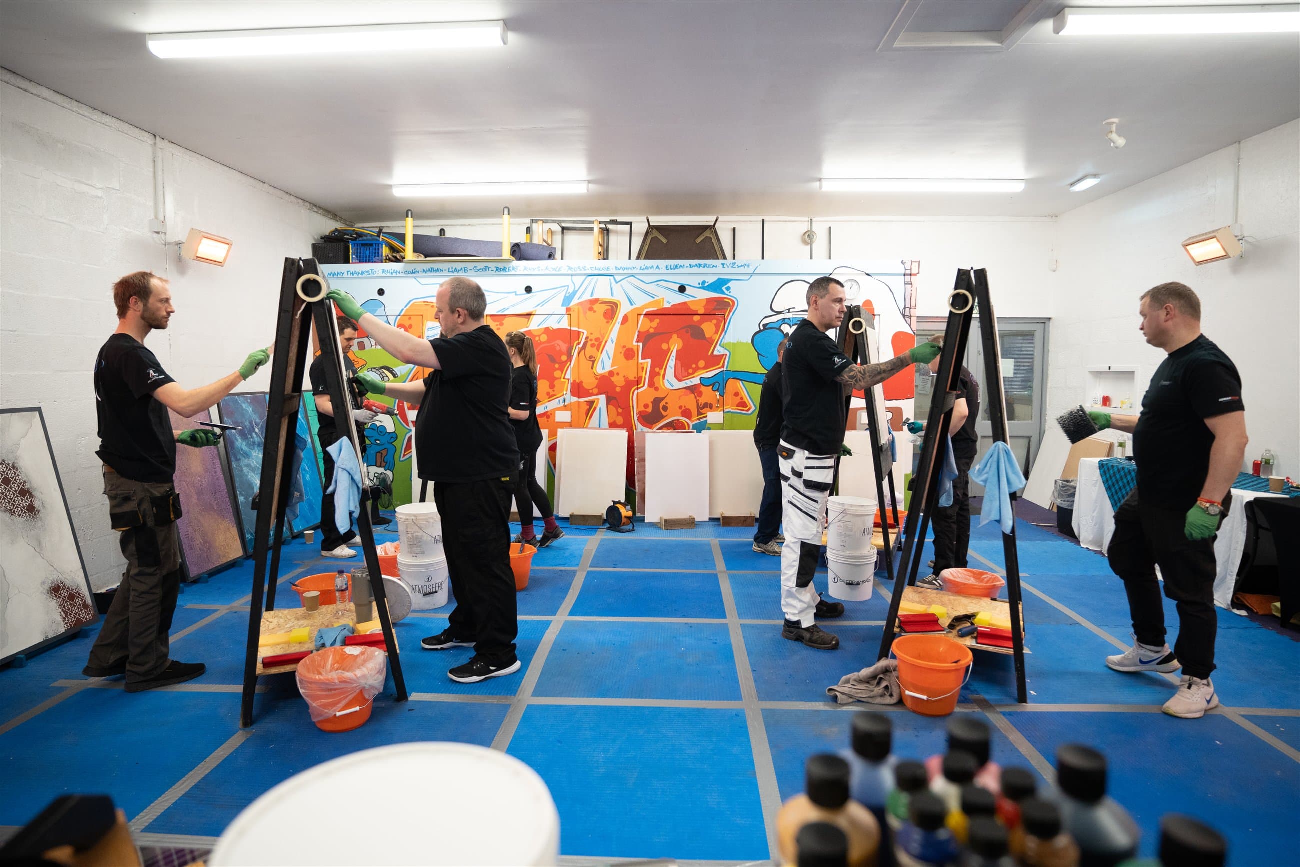 A specialist workshop team working together during a practical session